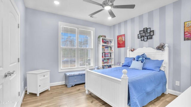 bedroom featuring visible vents, wallpapered walls, ceiling fan, baseboards, and light wood-style floors