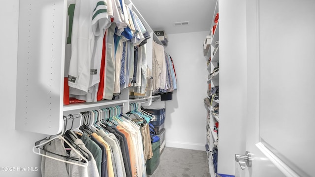 spacious closet featuring visible vents and carpet