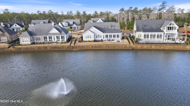 aerial view featuring a residential view and a water view