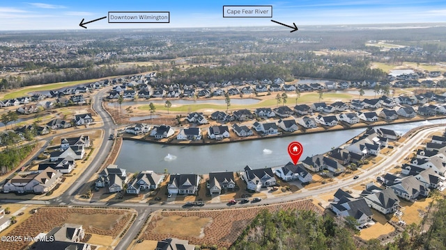 birds eye view of property featuring a residential view and a water view