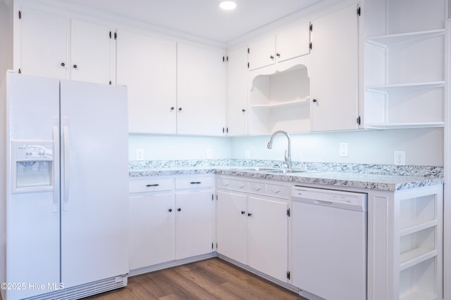 kitchen with white cabinetry, dark hardwood / wood-style flooring, sink, and white appliances