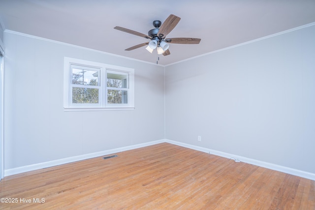 unfurnished room featuring ornamental molding, ceiling fan, and light wood-type flooring