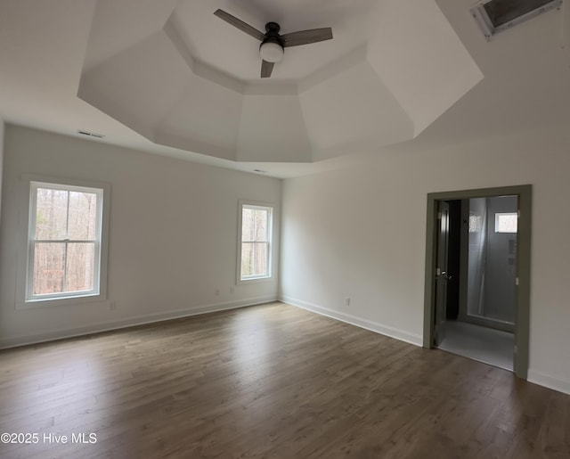 unfurnished room with hardwood / wood-style floors, high vaulted ceiling, and ceiling fan