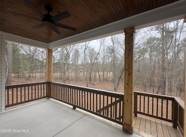 wooden terrace featuring ceiling fan