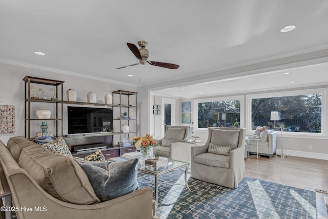 living room with recessed lighting, crown molding, and wood finished floors