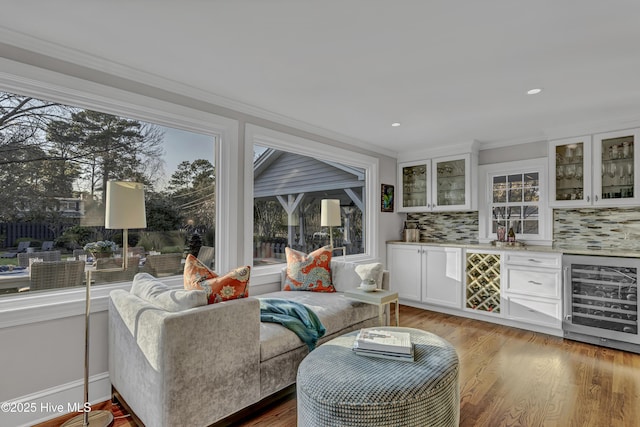 sunroom featuring a dry bar and beverage cooler