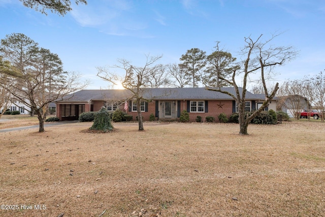 ranch-style house with a front lawn