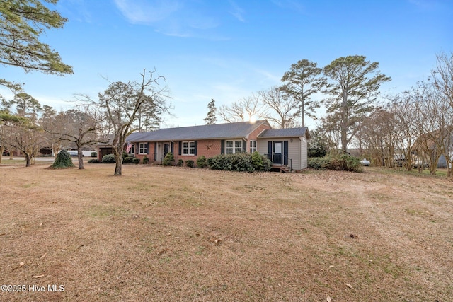 ranch-style house with a front yard