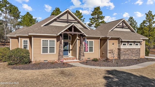 craftsman-style house featuring a shingled roof and crawl space