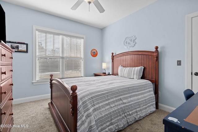 bedroom featuring baseboards, a ceiling fan, and light colored carpet