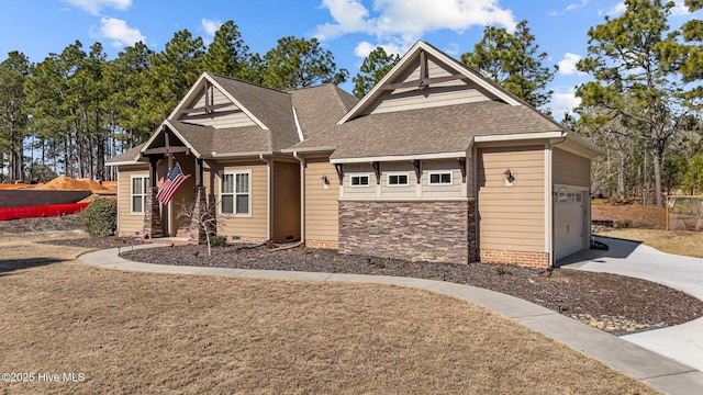 craftsman-style home featuring crawl space, stone siding, a garage, and roof with shingles