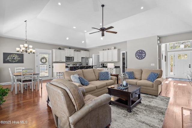 living area featuring a tray ceiling, dark wood-style flooring, and plenty of natural light