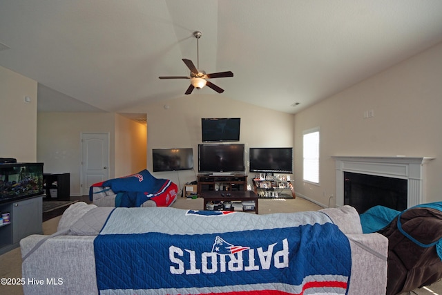 living room featuring lofted ceiling, ceiling fan, and carpet