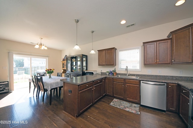 kitchen with dark hardwood / wood-style floors, dishwasher, sink, hanging light fixtures, and kitchen peninsula