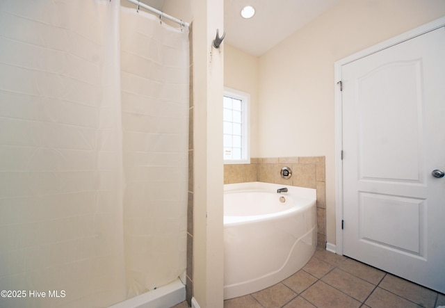 bathroom featuring a washtub and tile patterned floors