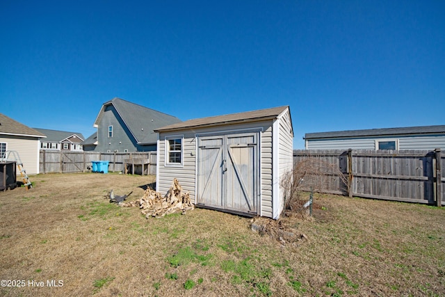 view of outbuilding featuring a yard