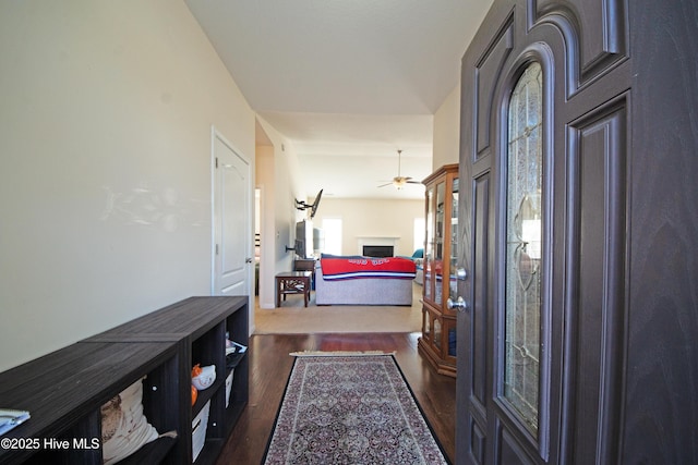 entryway with dark hardwood / wood-style floors and ceiling fan