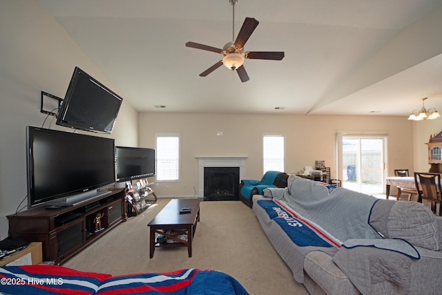 carpeted living room featuring ceiling fan