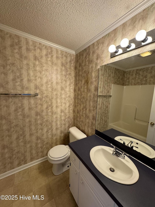 bathroom with toilet, vanity, walk in shower, crown molding, and a textured ceiling