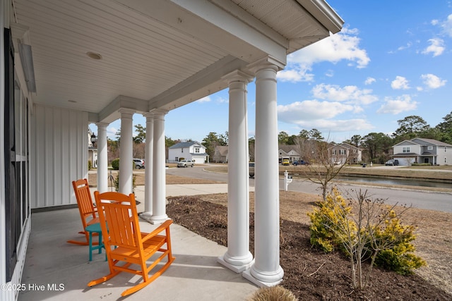 view of patio / terrace with covered porch and a residential view