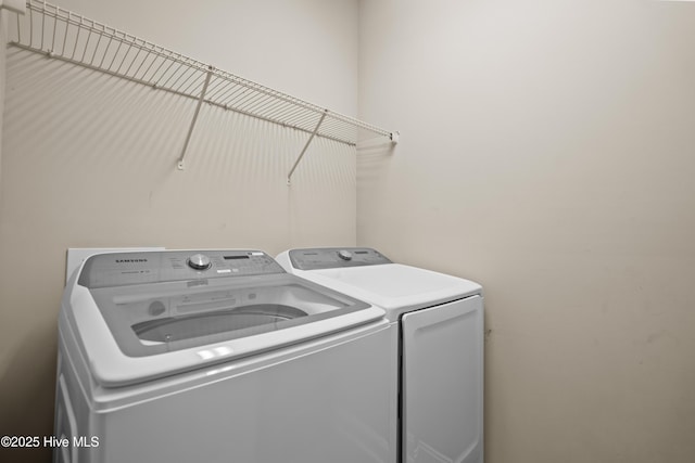 laundry room featuring laundry area and washing machine and clothes dryer