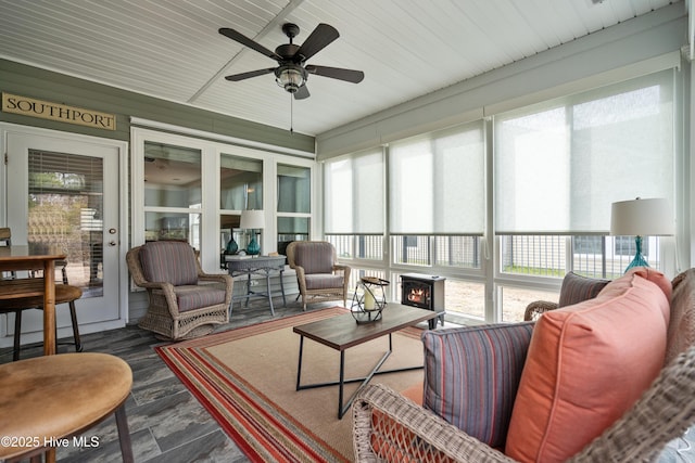 sunroom / solarium featuring ceiling fan and a healthy amount of sunlight