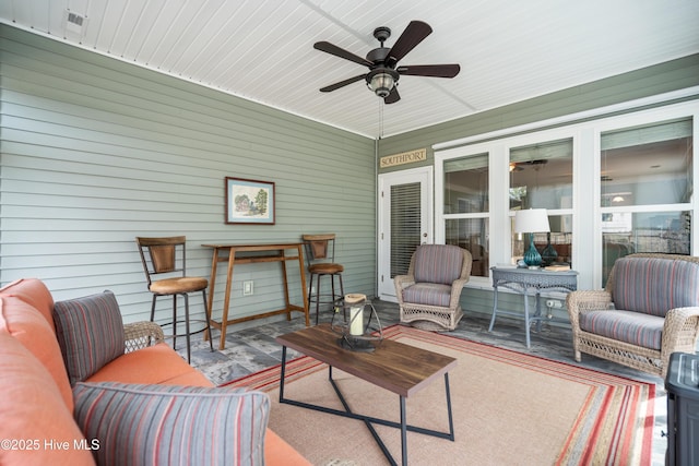 sunroom with a ceiling fan