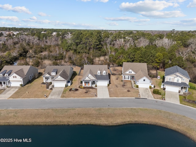 birds eye view of property featuring a residential view and a water view