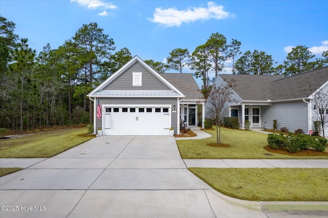 view of front of house with a garage and a front yard