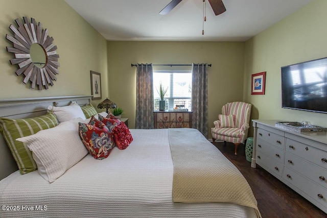 bedroom featuring ceiling fan and dark hardwood / wood-style flooring