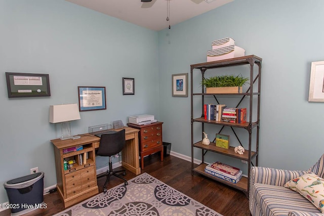 home office with dark wood-type flooring and ceiling fan