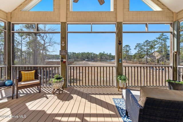 sunroom / solarium featuring vaulted ceiling