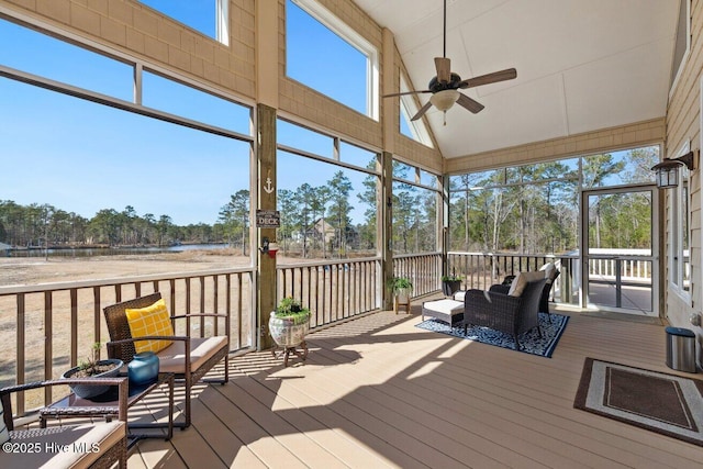 sunroom featuring ceiling fan and vaulted ceiling