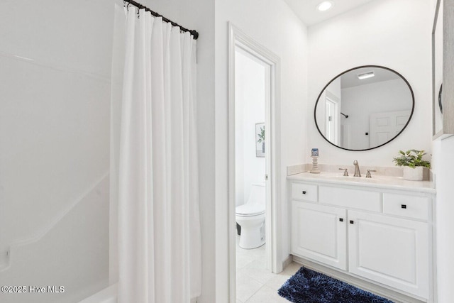 full bathroom with a shower with shower curtain, toilet, vanity, and tile patterned flooring