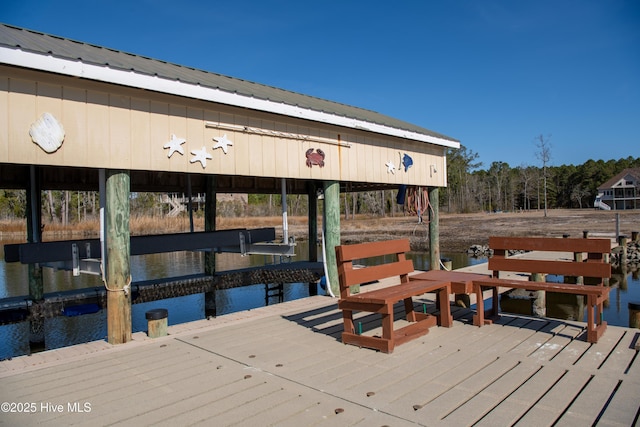 view of dock featuring boat lift and a water view