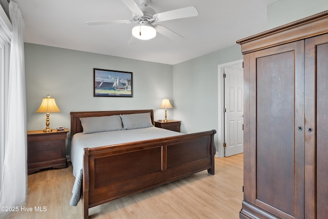 bedroom featuring a ceiling fan and light wood finished floors