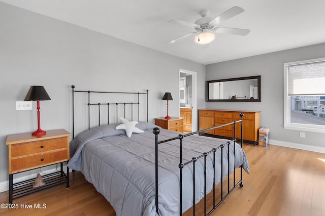 bedroom featuring light wood-type flooring, ceiling fan, and baseboards