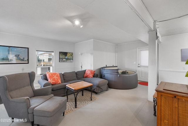 living area with concrete floors