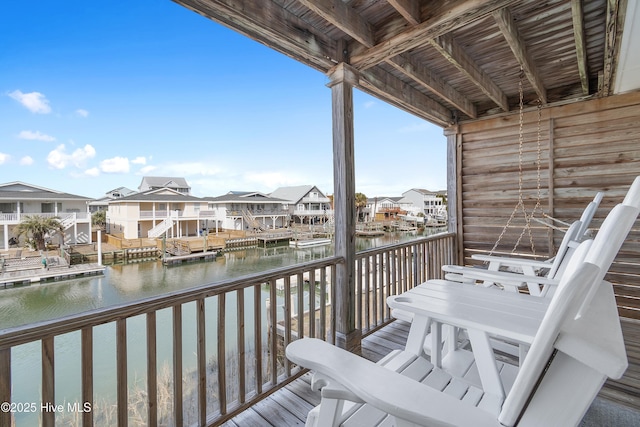 balcony with a water view and a residential view