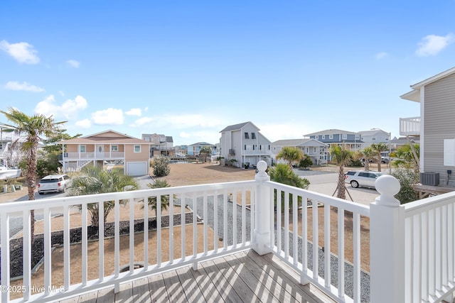 balcony with central AC unit and a residential view