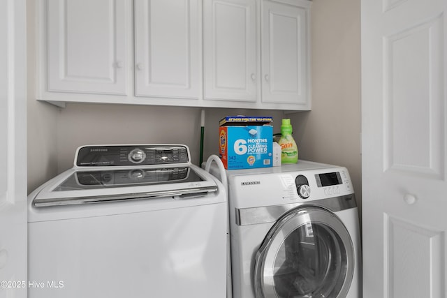 laundry area featuring cabinet space and washer and dryer