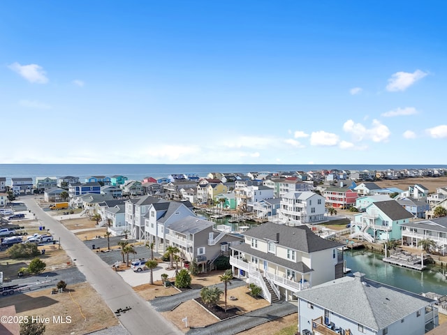 birds eye view of property featuring a water view and a residential view