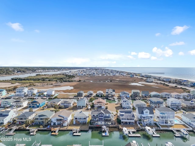 aerial view with a residential view and a water view