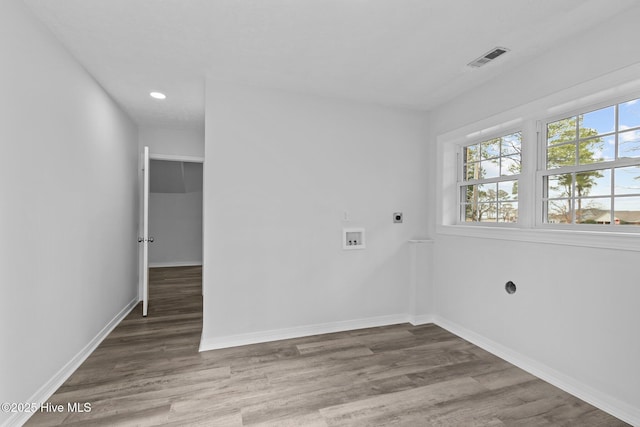 spare room with hardwood / wood-style floors