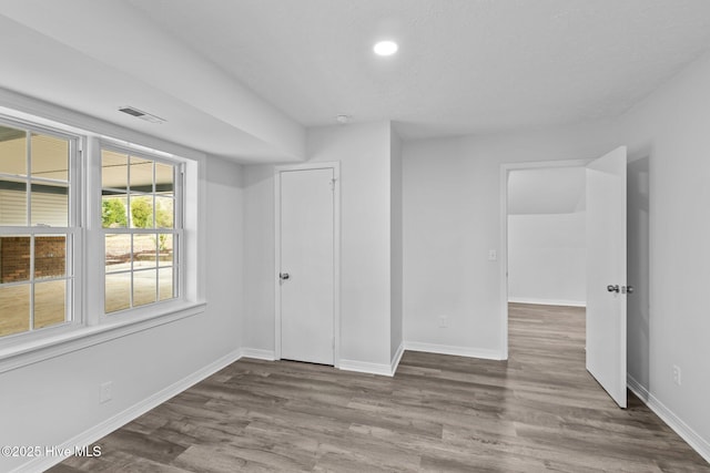 2131 Neuse Cliffs Cir, New Bern, NC 28560 - unfurnished bedroom featuring wood finished floors, baseboards, and recessed lighting