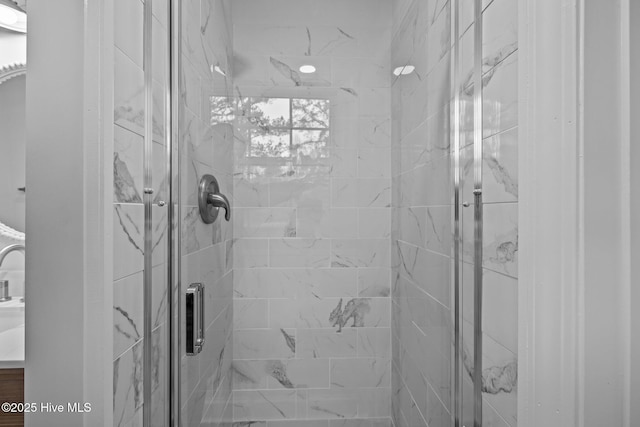 bathroom featuring an enclosed shower