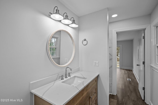 2131 Neuse Cliffs Cir, New Bern, NC 28560 - bathroom featuring vanity, wood finished floors, and recessed lighting