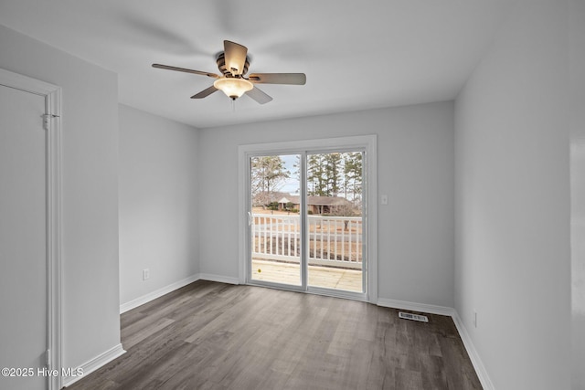 unfurnished room featuring hardwood / wood-style flooring and ceiling fan