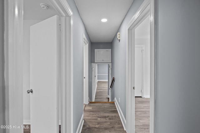 hallway with wood-type flooring