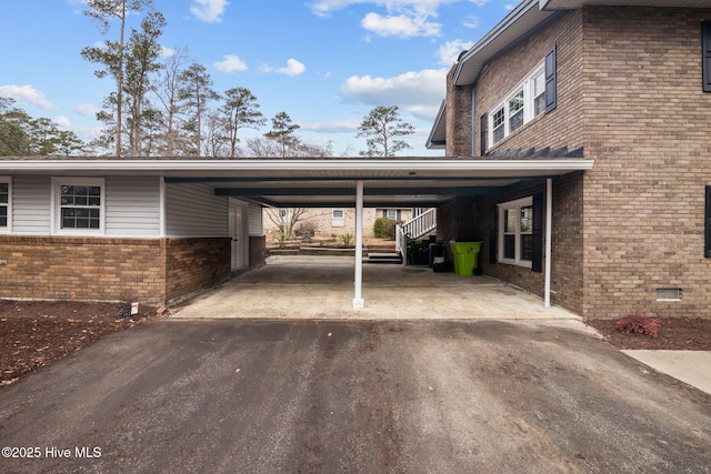 view of parking / parking lot with a carport